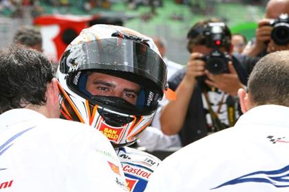 Marc Melandri came second despite a broken drinking valve showering him under braking