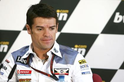 Carlos Checa has qualified ninth for the Valencia MotoGP round despite an intestine infection