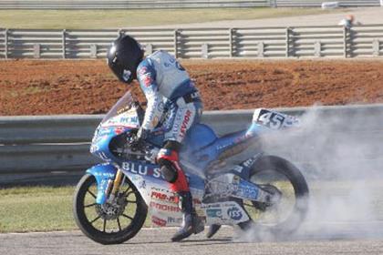 Scott Redding celebrates his Valencia win with a post-race burn-out