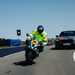 BMW S1000RR and BMW car on TT course
