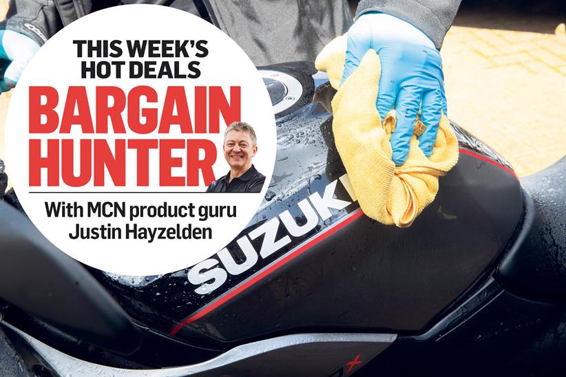 Wiping the fuel tank on a Suzuki motorcycle, with MCN's Bargain Hunter logo