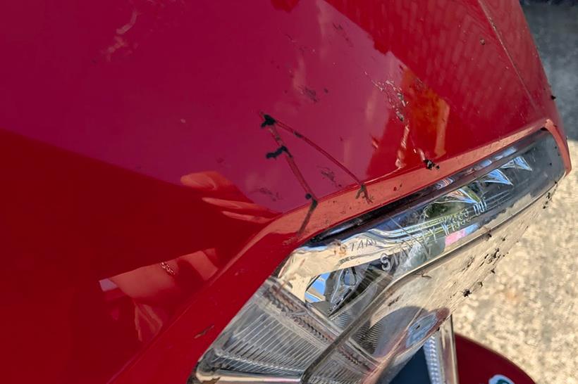 The scratch on the Honda VFR800's fairing is annoying but won't stop play