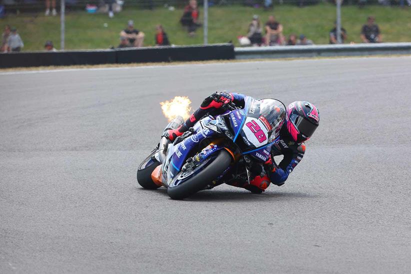 Bradley Ray's Raceways Racing Yamaha R1 spits flames going through the final corner at Donington Park.
