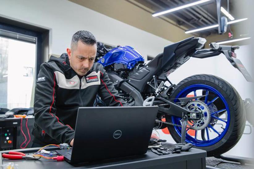 Liam Coffey working on a Yamaha MT09