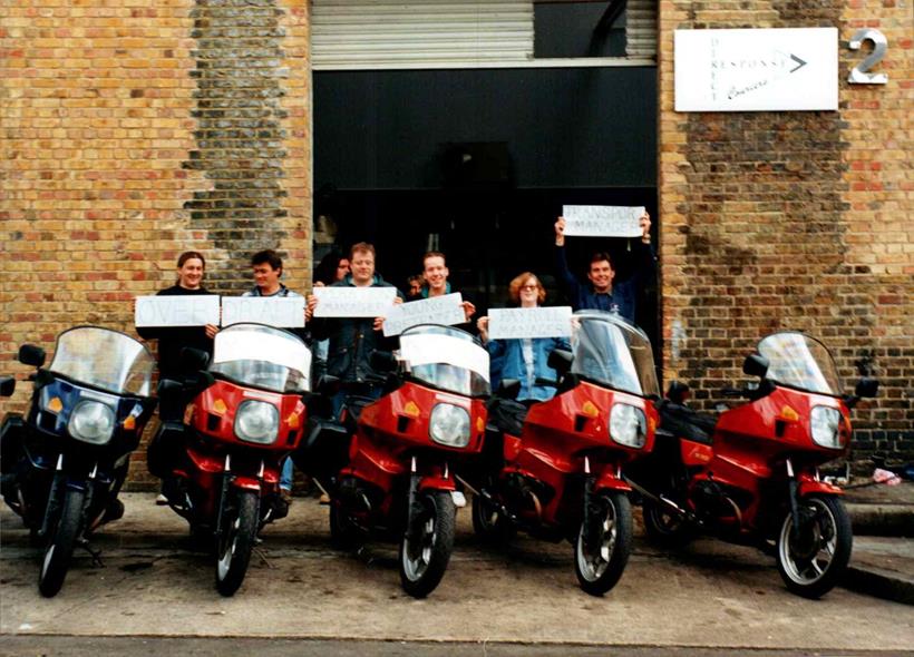 Mark (far left) and Ian (first left) with a row of courier bikes