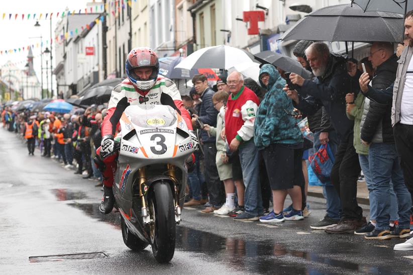 Carl Fogarty rides through crowds in Ballymoney