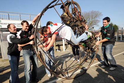 Ian Lougher - seen on the left - tries out a stunt bike with his rivals (Pic: Pacemaker Press International)