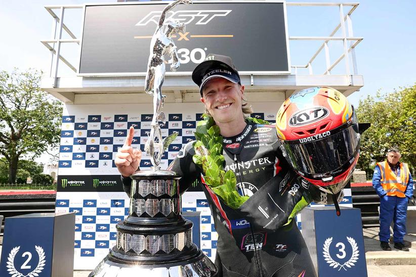 Davey Todd celebrates victory in the opening Superbike TT race.