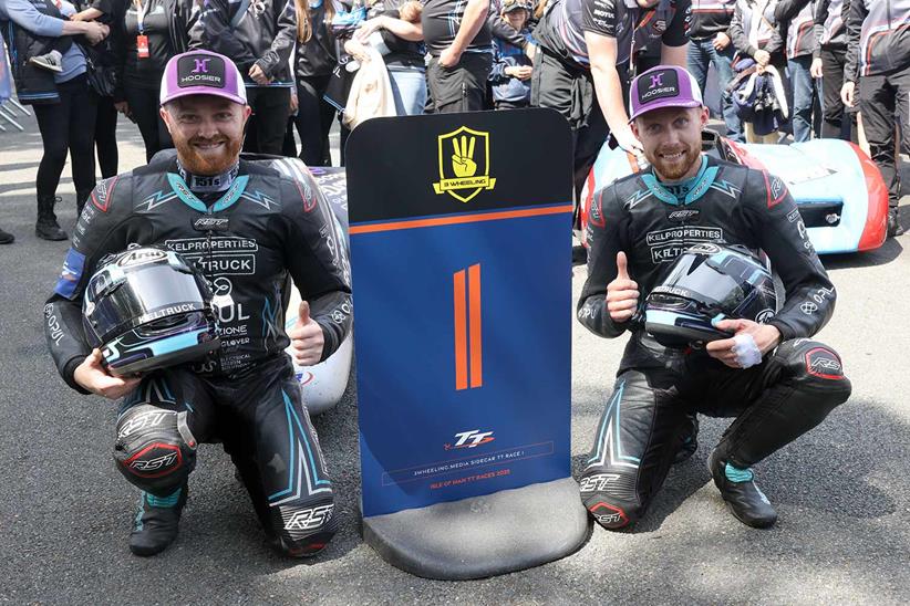 Ryan and Callum Crowe celebrate winning the opening Sidecar TT race on the Isle of Man.