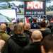 Crowds watch a narrated lap of the TT course
