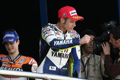 Valentino Rossi steps up to the podium for the 100th time