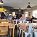 People sitting around inside the Yondermann Café