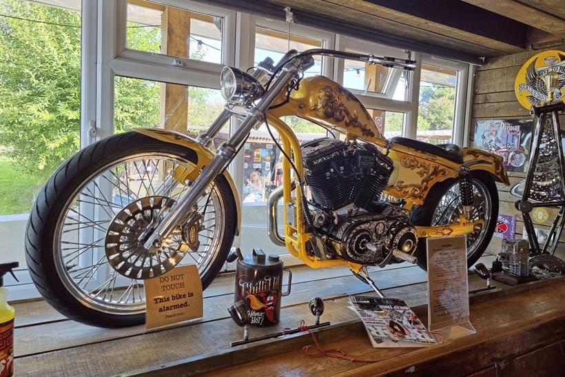 A motorbike in Custom Cafe's window display