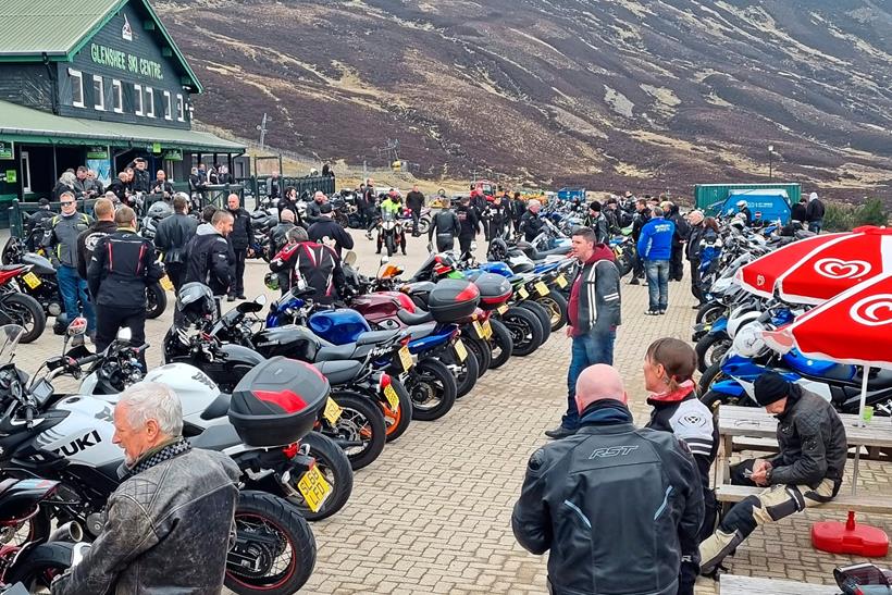 lots of bikers and their bikes parked outside the ski centre at Tea @ the Shee