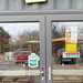 Entrance to Amici Coffee showing MCN Pit Stop sticker on the door