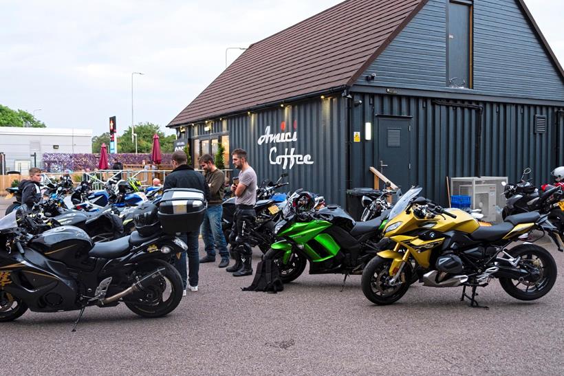 People and motorcycles outside Amici Coffee