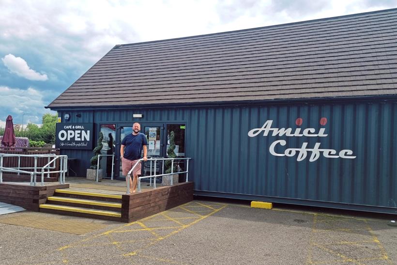 Kevin McCloud standing outside Amici Coffee entrance