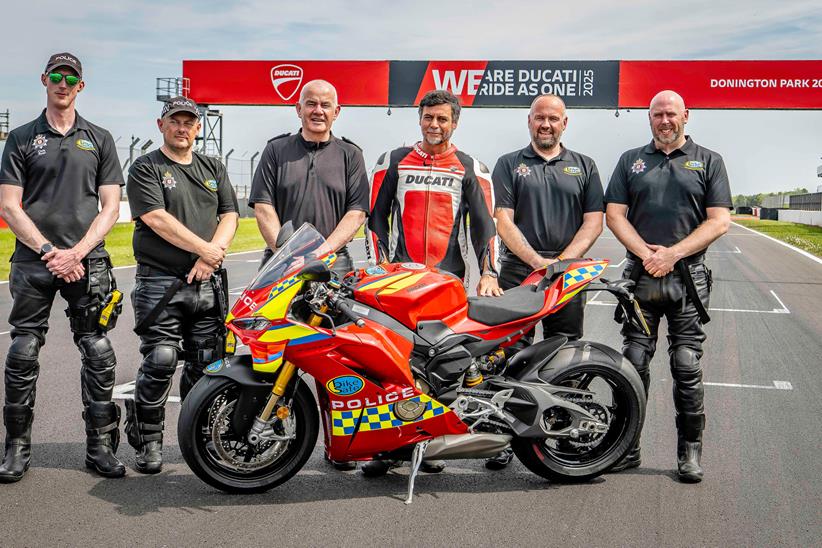 Fabrizio Cazzoli stands with members of the BikeSafe team