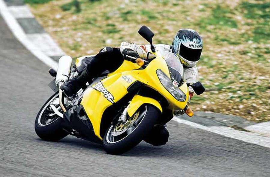 Suzuki TL1000R in yellow with knee down