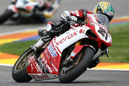 Troy Bayliss showed no ill effects of his cycling crash as he posted the fasted time in Assen this morning