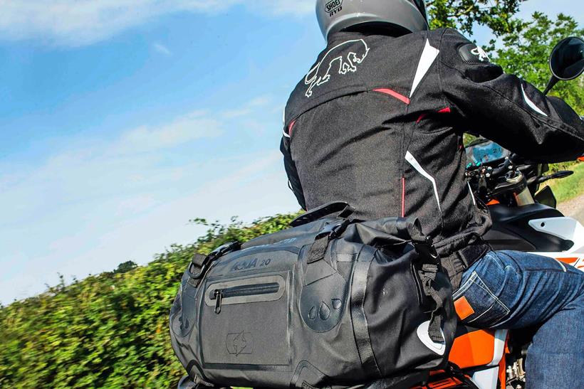 rider with roll bag
