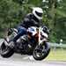 2025-on BMW R1300R cornering on a wet road
