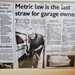 An old article about the garage in black and white on display on the wall.