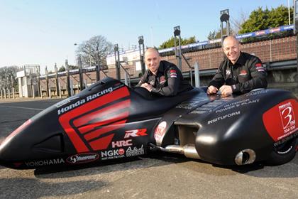 Nick Crowe and passenger Mark Cox have taken victory in the Isle of Man Sidecar race A this afternoon (Pic: Pacemaker Press)