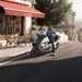 BMW CE 04 parked outside a cafe