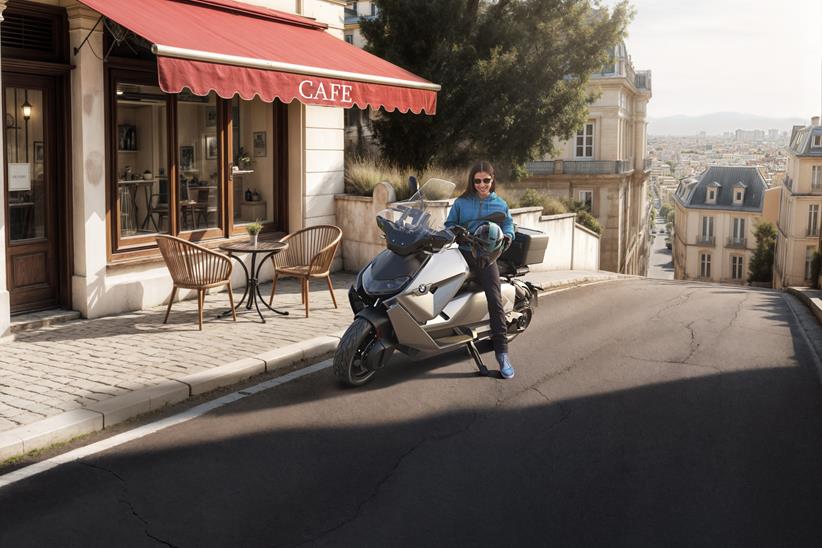 BMW CE 04 parked outside a cafe