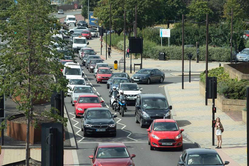 Bikers filtering through traffic