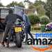 Motorcycle thieves putting a motorcycle in the back of a van, with Amazon Prime Day branding