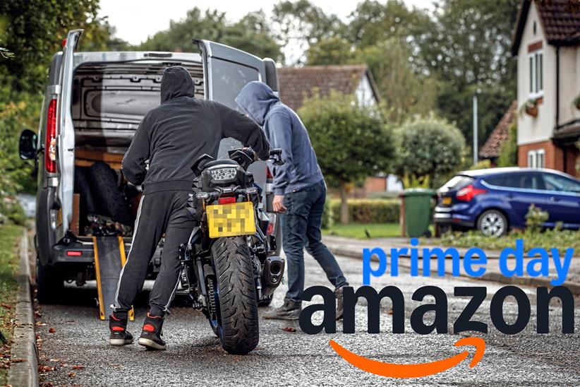 Motorcycle thieves putting a motorcycle in the back of a van, with Amazon Prime Day branding