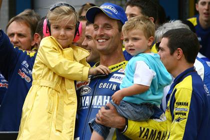 Colin Edwards celebrates his unlikely podium in Assen with his children Gracie and Hayes