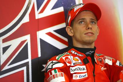 Casey Stoner sets lap record to claim pole position for the German MotoGP 