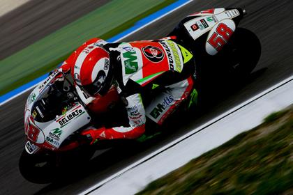 Marco Simoncelli dominated the German 250 GP to win the race and secure top spot in the world championship