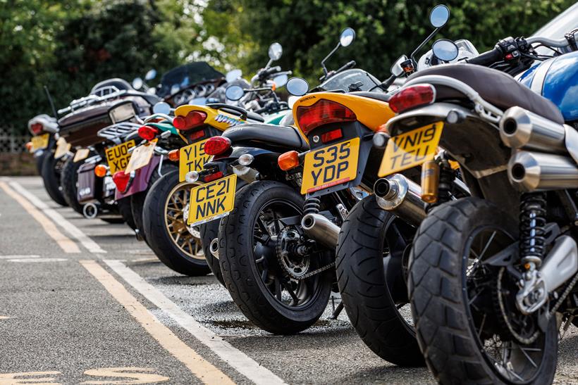 A group of motorcycles parked in a row
