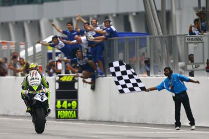 Rossi survived gruelling 40 degree heat to secure his ninth win of 2008 and his 150th career rostrum