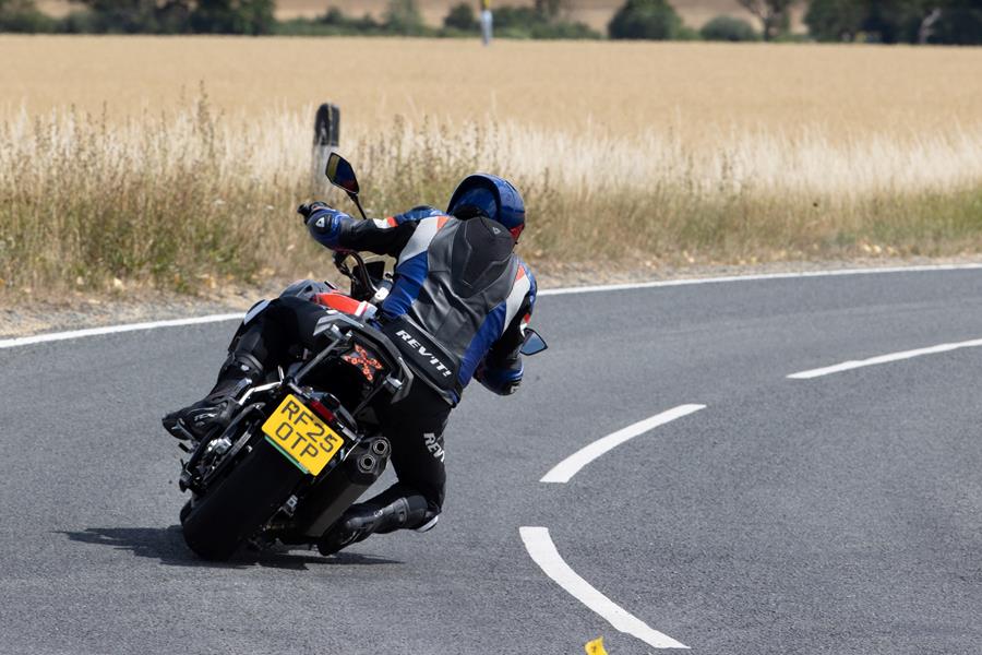 2025 Bimota Tesi H2 Tera, leaning right and navigating a country road
