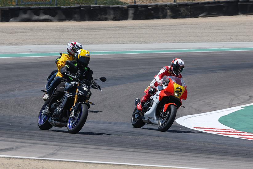 Wayne Rainey cornering on the Yamaha XSR900 GP alongside other riders