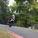 Ian Simpson wheelies over the Mountain at Cadwell Park