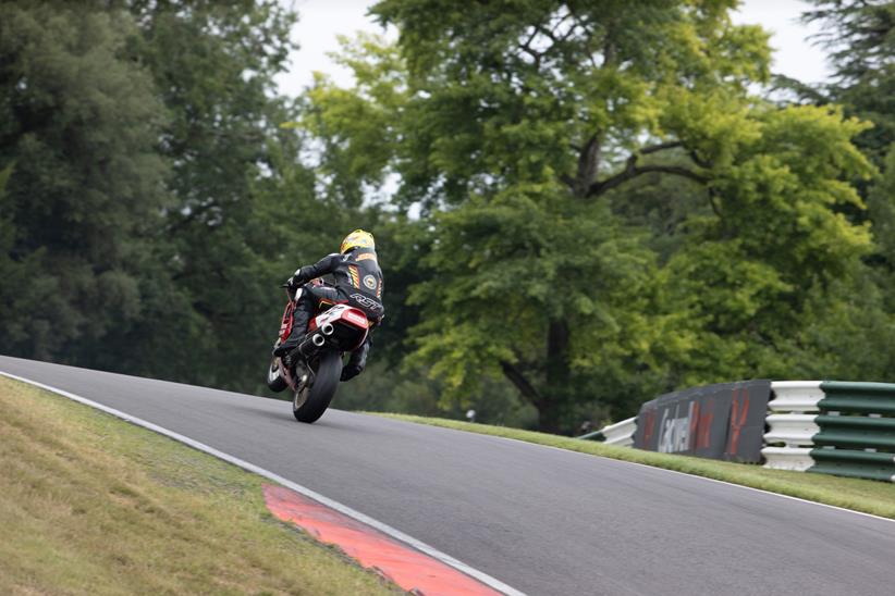 Ian Simpson wheelies over the Mountain at Cadwell Park