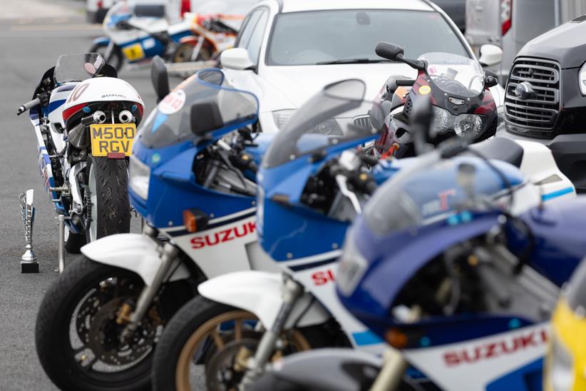 Multiple Suzuki RG500 road bikes parked together