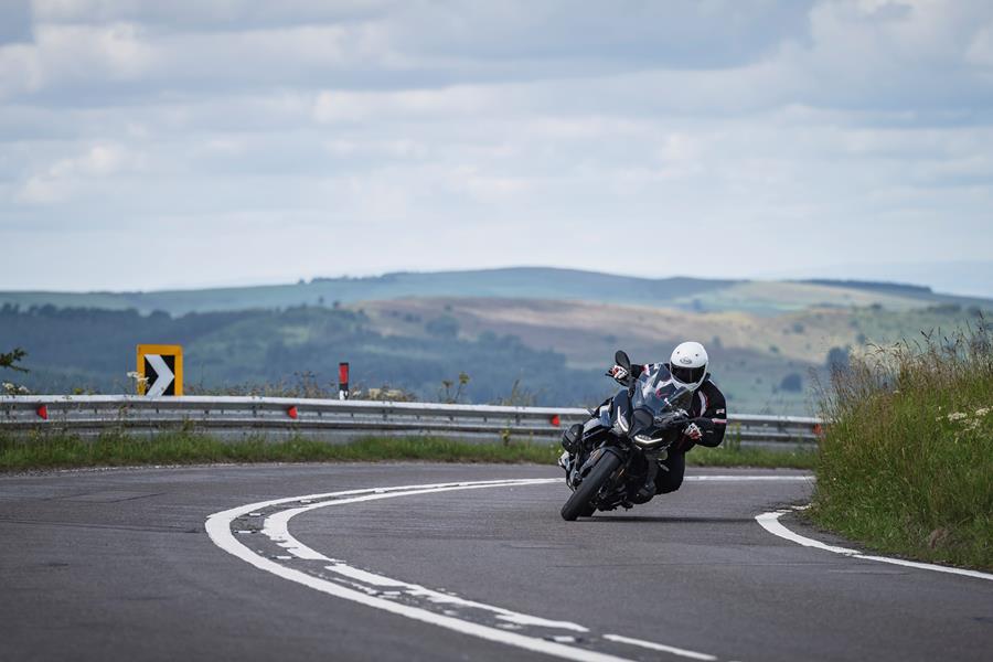 2025-on BMW R1300RS leaning into a corner