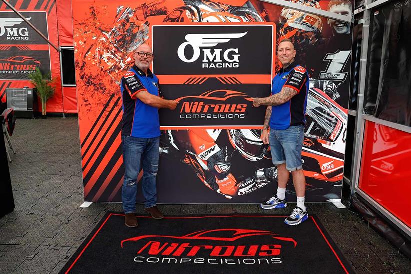 Alan Gardner shakes hands with new OMG Racing owner Dave Williams.