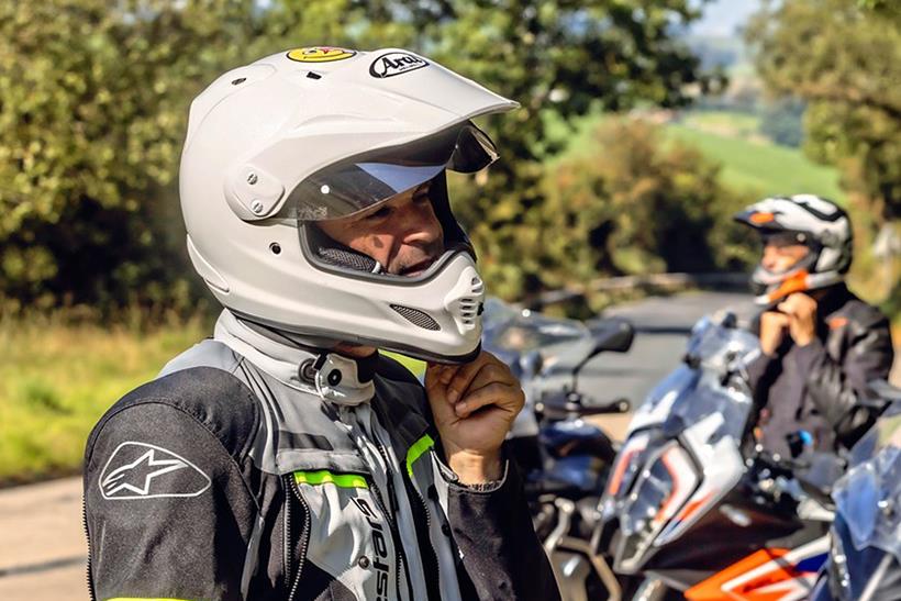 Riders with peaked helmets