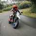 2025-on Suzuki DR-Z4SM front pic heading into a corner