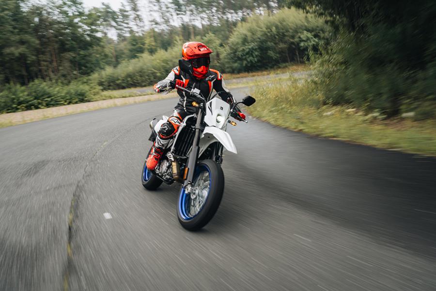 2025-on Suzuki DR-Z4SM front pic heading into a corner
