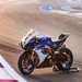 Blue and white Suzuki GSX-R1000R on a paddock stand
