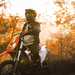 A rider stood over a KTM 690 Enduro R